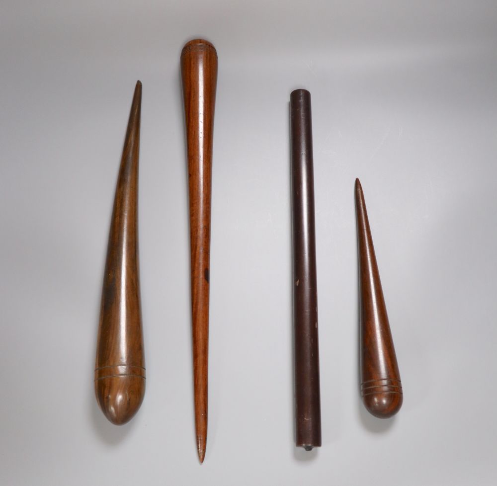Three 19th century lignum vitae fids and a similar rule, longest 45.5cm